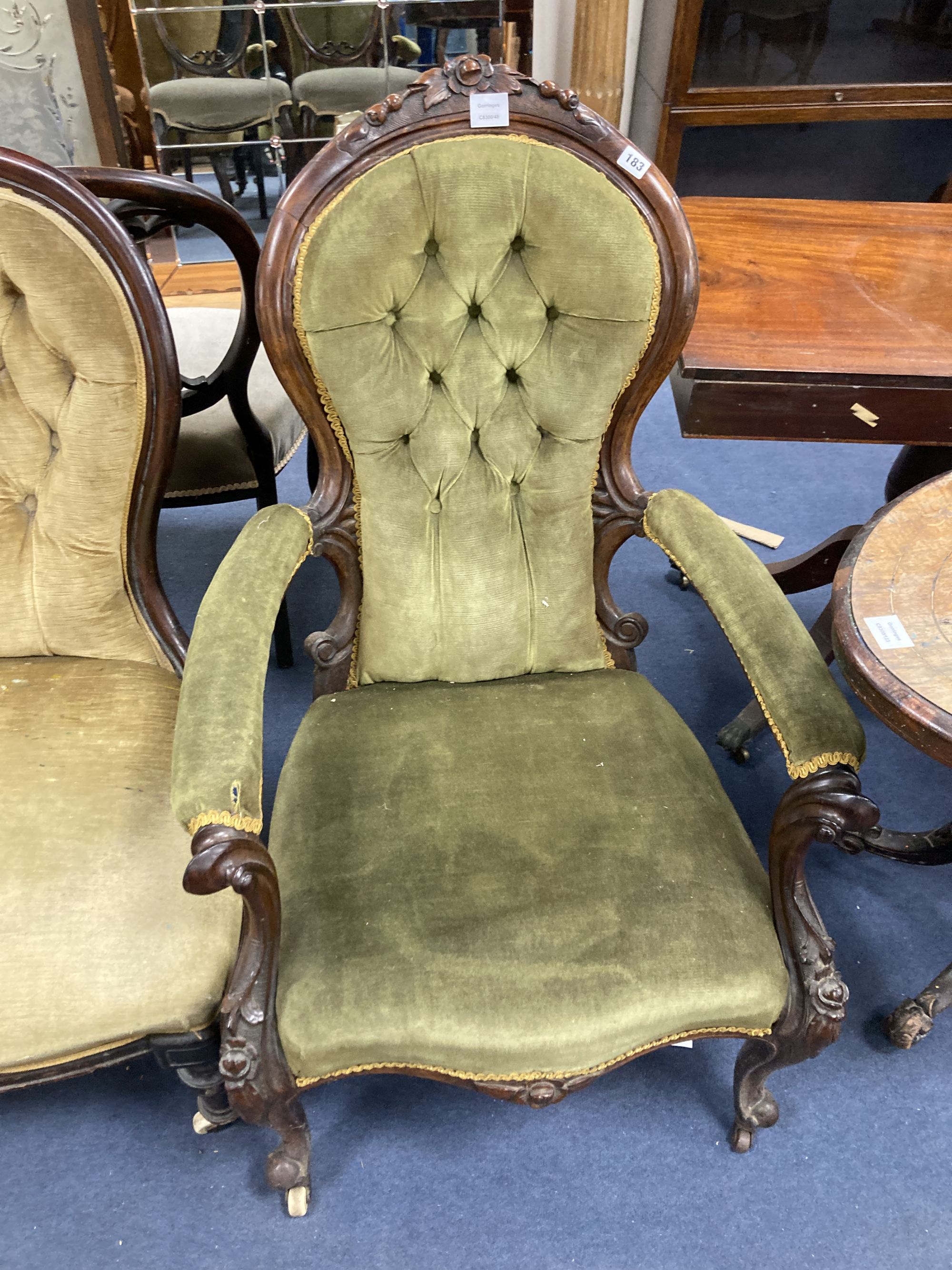 A Victorian mahogany open armchair, a Victorian nursing chair, five balloon back dining chairs and a caned chair